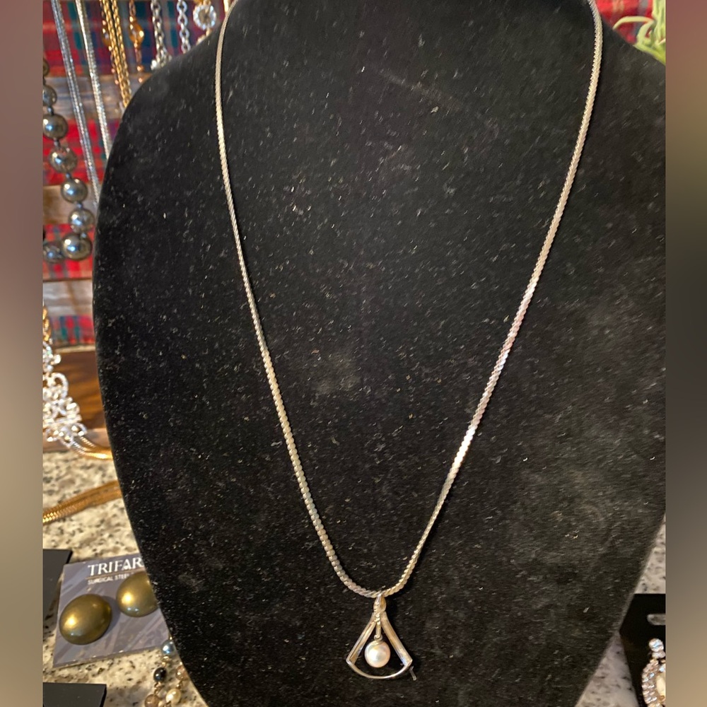 Silver toned necklace with faux pearl pendant
